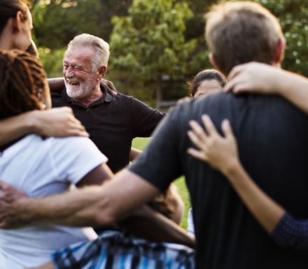 New Image Group of adults huddled together